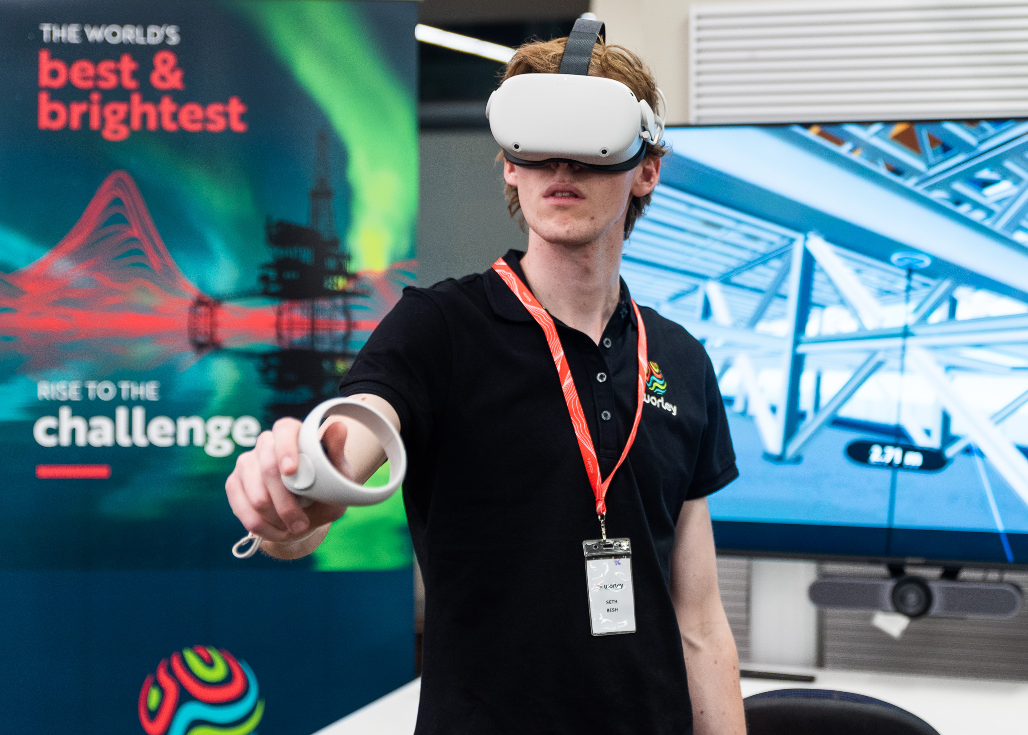 Young man using virtual reality goggles and handset at the Apprenticeship and traineeship support forum