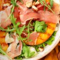 A link to read the recipe for grilled peach and prosciutto salad with yoghurt dressing