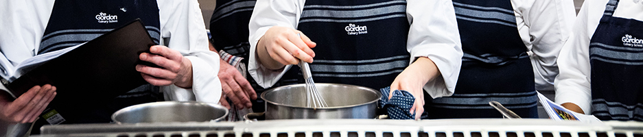 Cookery and Hospitality - VETDSS - trainee chefs wearing aprons